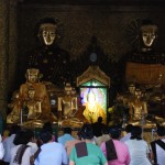 Yangon - People praying at Shwedagon Pagoda