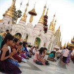 Yangon - People praying at Shwedagon Pagoda